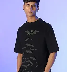 Rear view of a man in a black t-shirt featuring a detailed Erik Killmonger mask graphic.