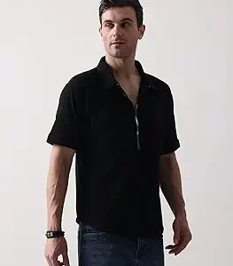 Rear view of a man wearing a black t-shirt with a detailed grey and gold Erik Killmonger tribal mask graphic.