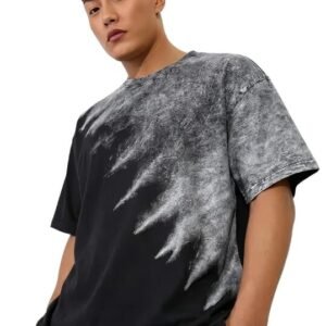 Front view of a man wearing a black oversized t-shirt with a grey abstract winged acid-wash graphic.