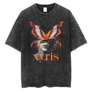 Front view of a charcoal acid wash oversized t-shirt featuring a surreal butterfly and face graphic with "Xyris" text.