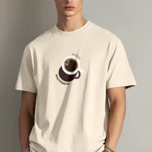 A man wearing a cream-colored t-shirt with a central graphic of a coffee cup and the words "Brew Happiness."