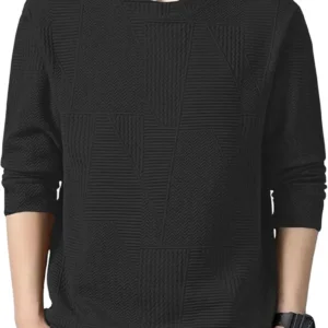 Man wearing a black textured long-sleeve sweater with grey pants and a wristwatch.