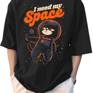 A person wearing an oversized black t-shirt featuring a cartoon cat in an astronaut suit with the text "I need my Space" in orange.